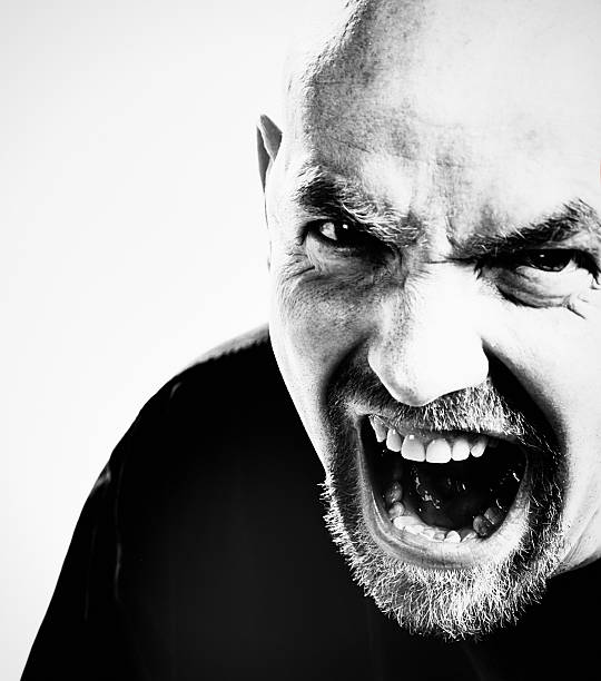 istock Terrifying man threatens, grimacing and yelling 617899484