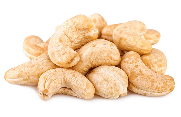 Cashew nuts on white. Cashew close-up Cashew nuts on white. Cashew close-up isolated on whie stock pictures, royalty-free photos & images