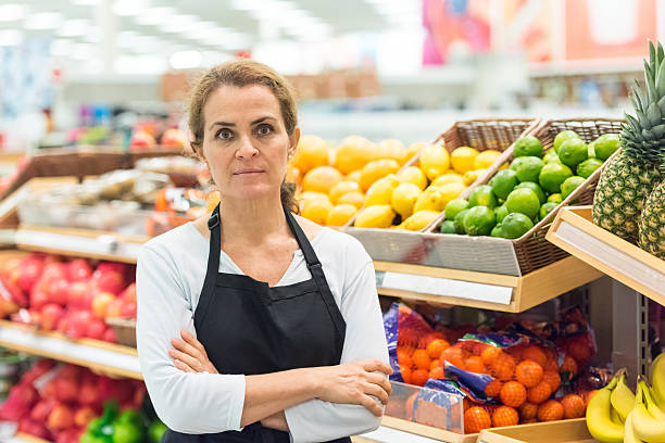 Mature female grocery store worker