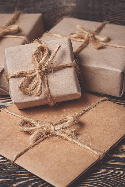 istock Christmas gifts box presents on brown 617904164