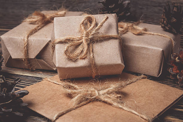 istock Christmas gifts box presents on brown 617904264