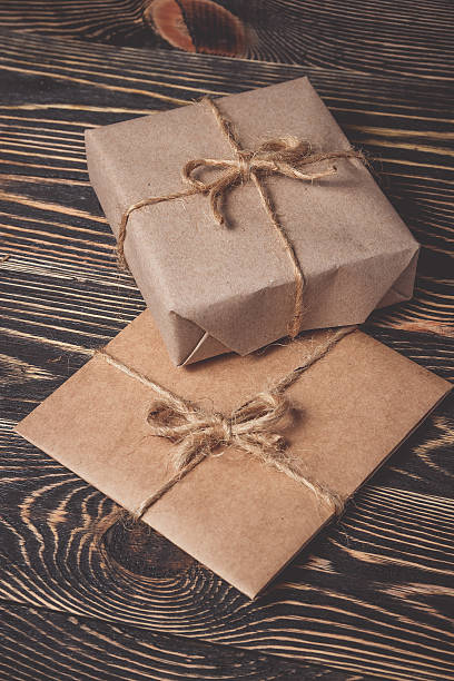 istock Christmas gifts box presents on brown 617904730