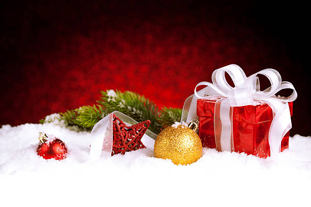 istock Christmas gift with decoration on snow 617906332