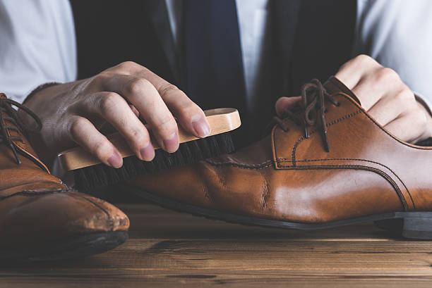 istock Men to care for leather shoes 617909498