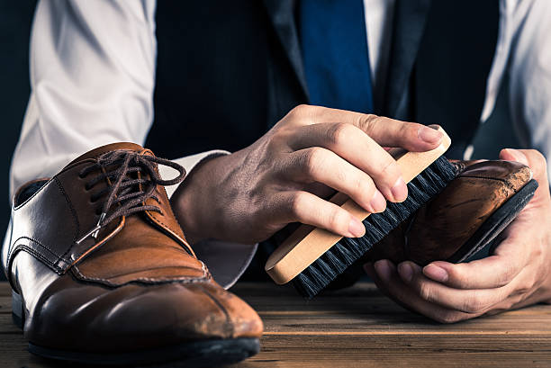istock Men to care for leather shoes 617909590
