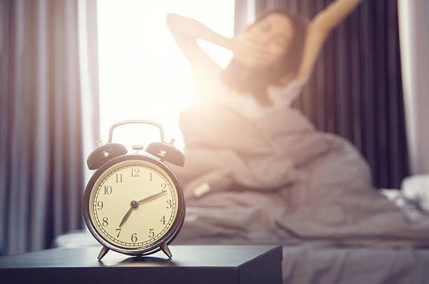 istock alarm clock having a good day in morning. 618023212
