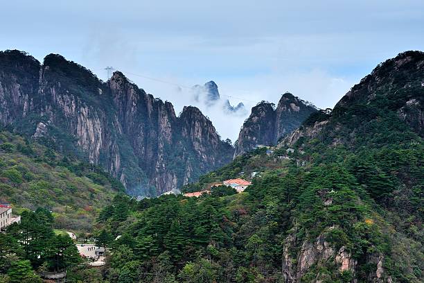 istock Flow of clouds in  Huangshan mountains valleys 07 618025092