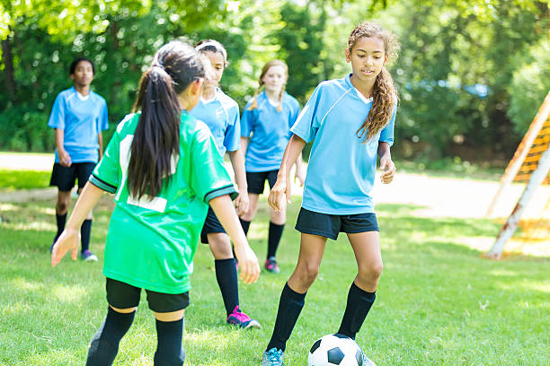 istock Female soccer player prepares to block kick 618029468