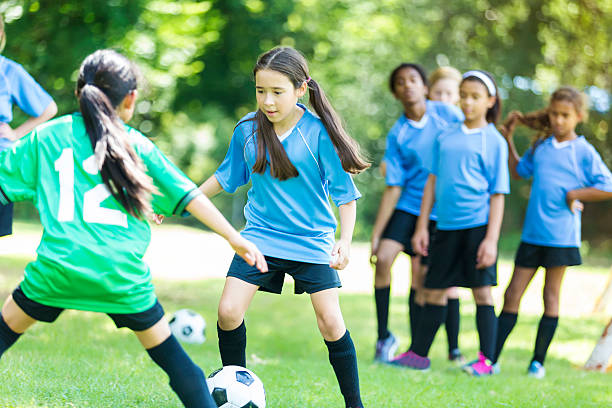 istock Girls' soccer teams face off 618029548