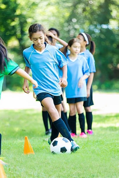 istock Soccer girls warm up before game 618029576