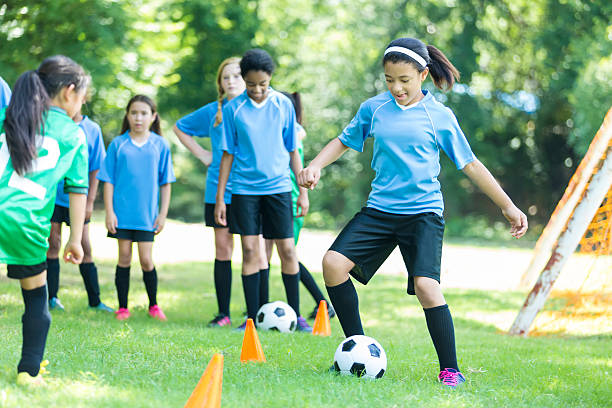 istock Confident African American soccer player practices with team 618029666