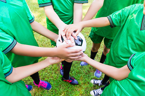 istock Soccer team holds ball before game 618029948