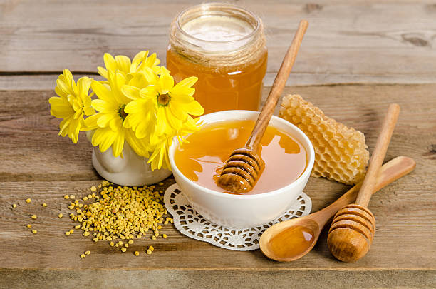 istock Yellow flowers and bee products (honey, pollen, honeycombs) 618034464