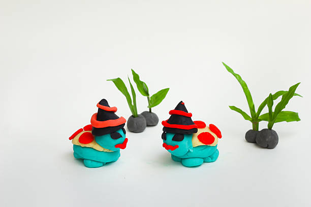istock Dough molding a Halloween turtle on a white background. 618034982