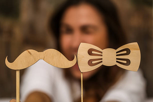 istock young girl with  moustache hipster 618035834
