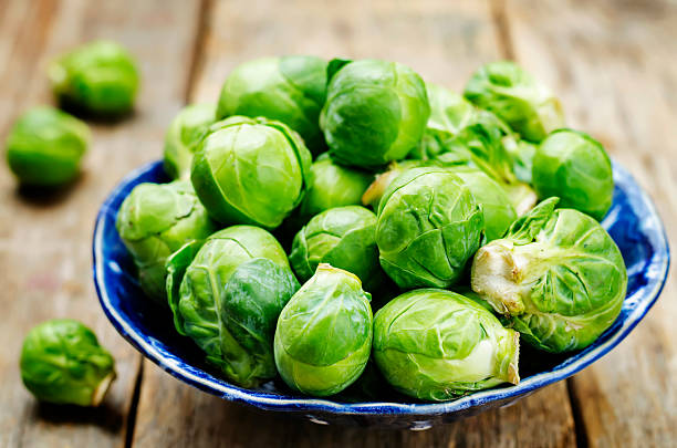 istock Brussels sprouts in a wooden bowl 618036750