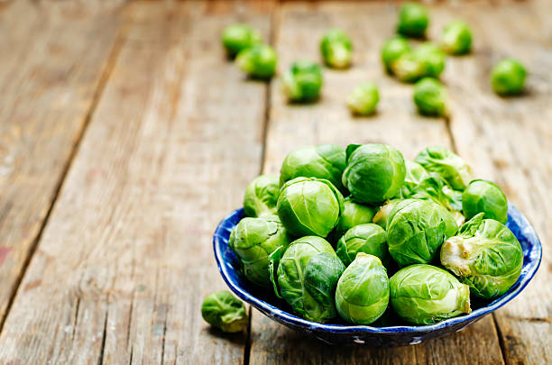 istock Brussels sprouts in a wooden bowl 618036770