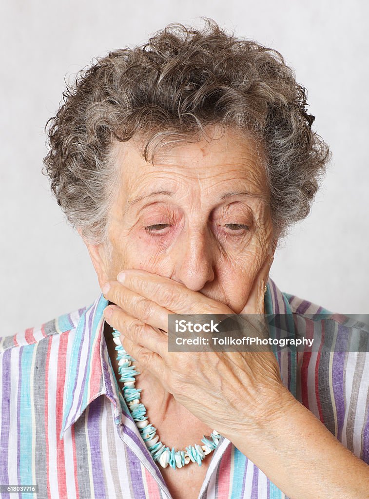 Senior woman show that her right are limited Senior woman between 70 and 80 years old that she is discriminated 70-79 Years Stock Photo