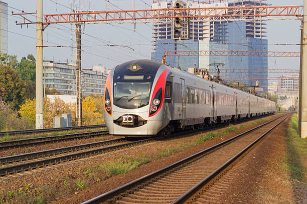 istock Passenger inter-city train on the background of urban developmen 618039030