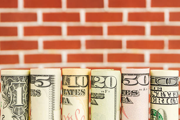istock rolls of american dollar banknotes in one row 618039760