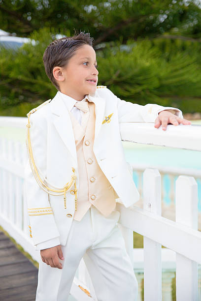 white suit with gold bow tie