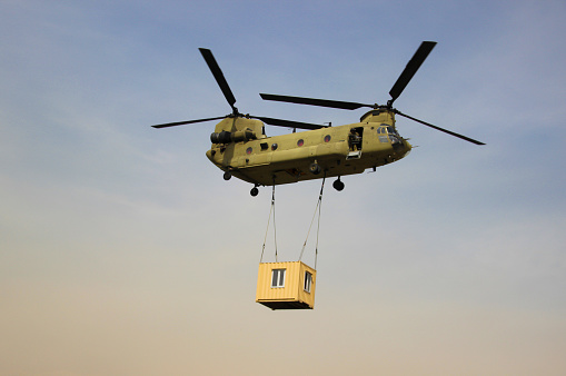 Chinook Carrying a container