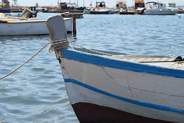 istock Blue small boats on the dock. Fragments 618042826