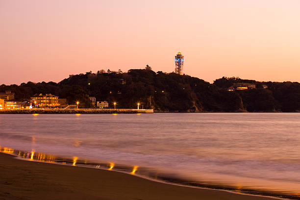 A lighthouse named Sea Candle in Enoshima illuminated with colorful lights