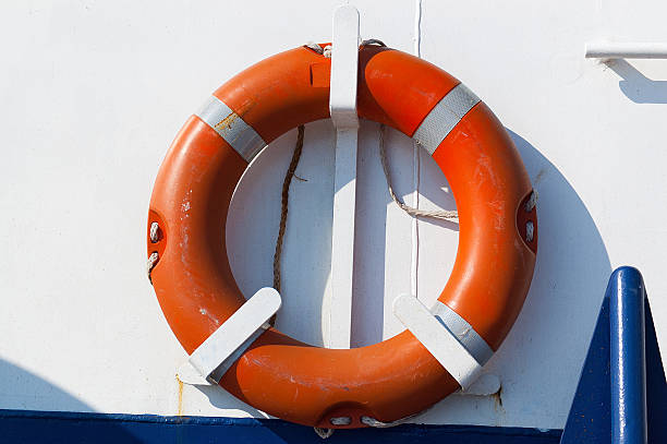 istock Orange Lifebuoy on a Ferry Boat 618043852