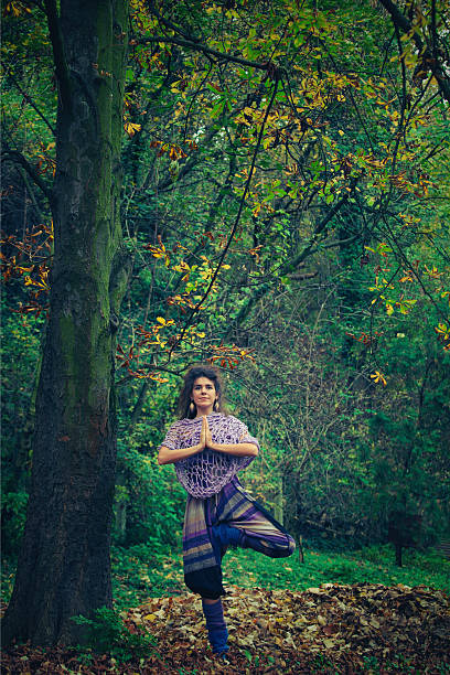 istock young woman practice yoga outdoor 618044444