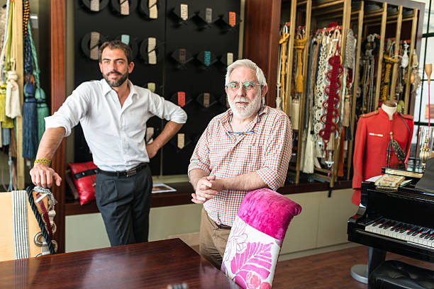istock two generations Industrial owner inside their factory 618044676