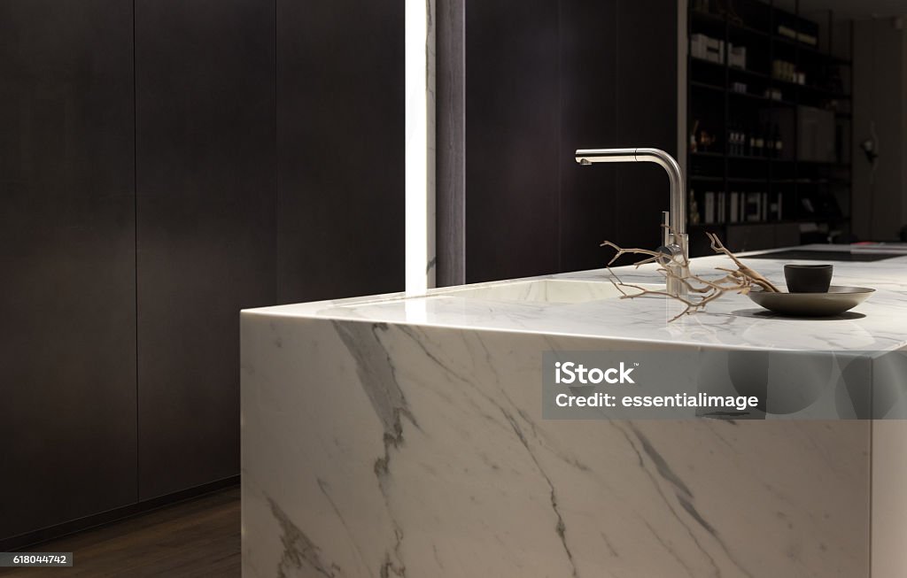 White Marble Kitchen Stylish Solid White Marble Kitchen Counter With Dark Cupboards Kitchen Stock Photo