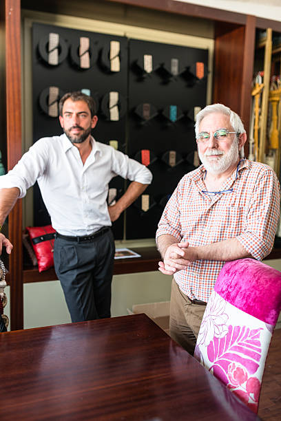 istock two generations Industrial owner inside their factory 618044804
