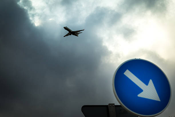 istock The plane in the cloudy sky. 618045078