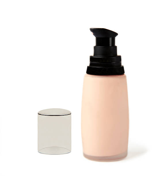 istock pink beige foundation bottle on white background 618045660