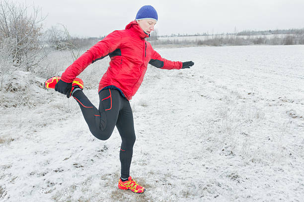 istock Active man making physical sport exercises in red nylon jacket 618047442