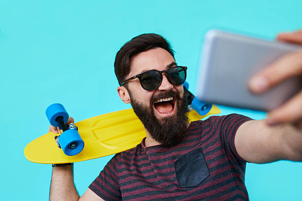 istock young man in casual clothes make selfie with his bright 618048932