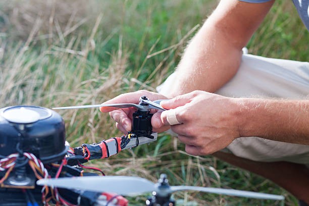 istock drone repairing on the field 618051244