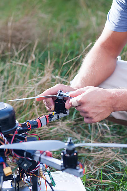 istock drone repairing on the field 618051412