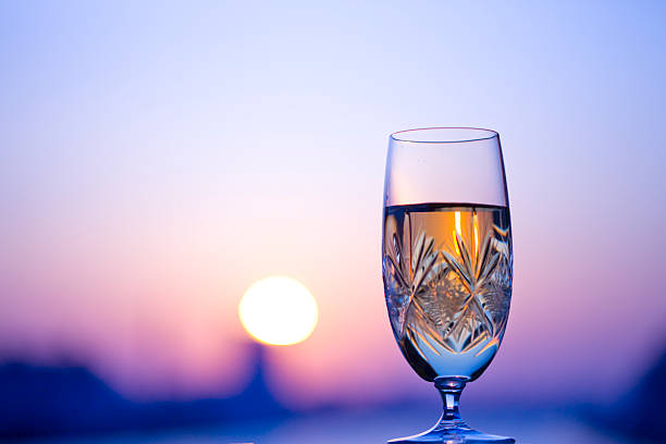 istock Glass of white wine in dusk 618051994