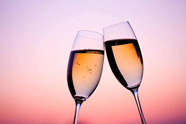 istock Two glass of white wine in dusk 618052236