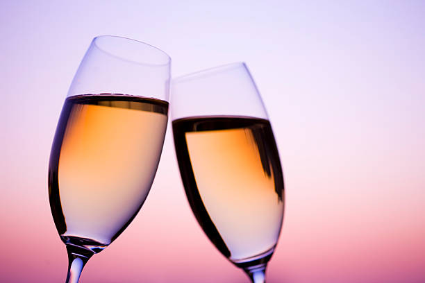 istock Two glass of white wine in dusk 618052356