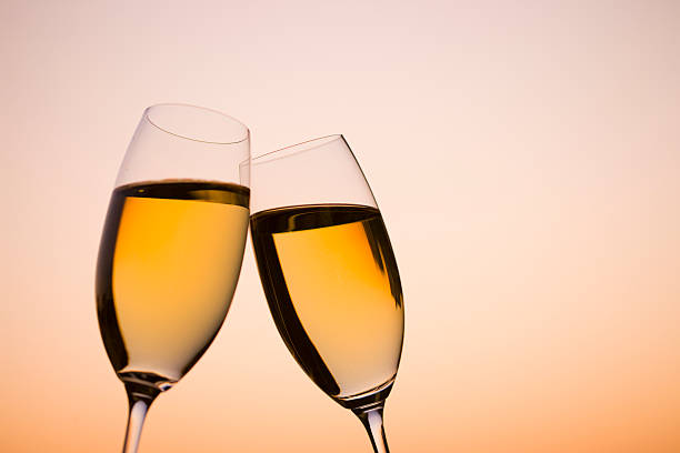 istock Two glass of white wine in dusk 618052388