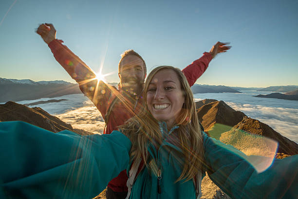 istock Young couple take selfie on mountain summit 618052574