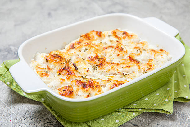 White fish casserole White fish casserole with cheese, sour cream and onion fish pie stock pictures, royalty-free photos & images