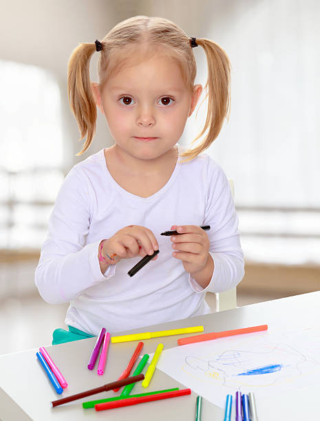 istock The girl draws with markers 618053600