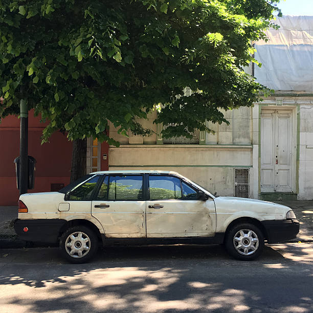 istock Damaged car parked in the street 618055856