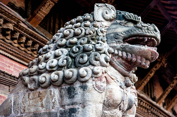 istock Stone guardian lion in Patan, Nepal 618057406