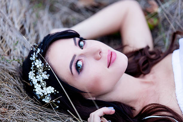 Portrait of a beautiful brunette woman with wreath in autumn outdoor
