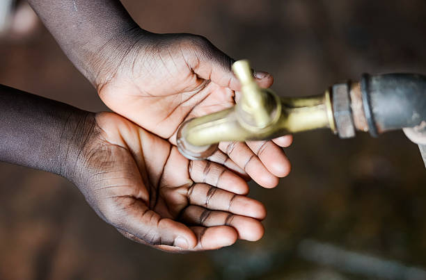 istock Close-Up African Black Girl Holding Hands Cupped 618058652